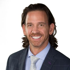Professional headshot of David Morgan, Founder and Owner of Morgan Financial, wearing a dark suit and smiling.